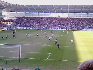 A full stadium looks out onto the action