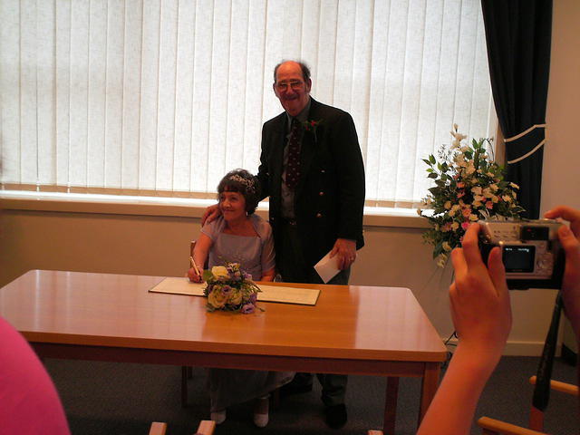 Signing the register.