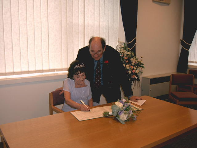 Signing the register.