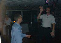 I wonder if he'll stop pointing at my crotch if I wave at the camera?