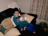 Rhys gives Owain a cuddle.