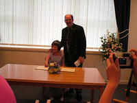 Signing the register.