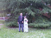 The bride and groom in the grounds of the register office.