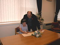 Signing the register.
