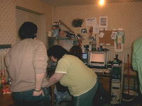 Coats and Caz play computers while Alina looks on... and is that a mixed Rubik Cube there? Must fix that!